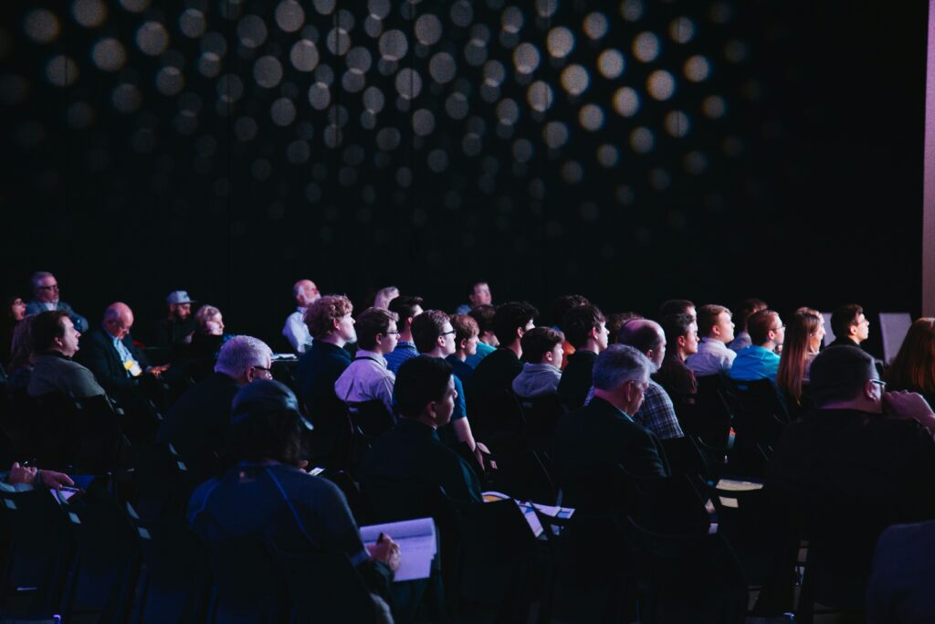 People listening to a conference